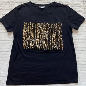 Black and gold It girl T-shirt.  Woman’s size M